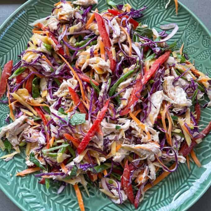 A close up of Thai Style Chicken Slaw on a round platter