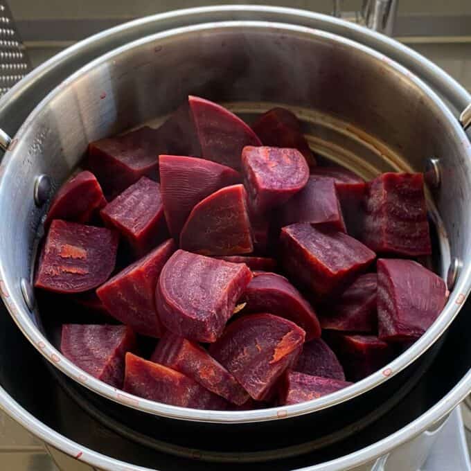 Cubed beetroot cooling in a colander