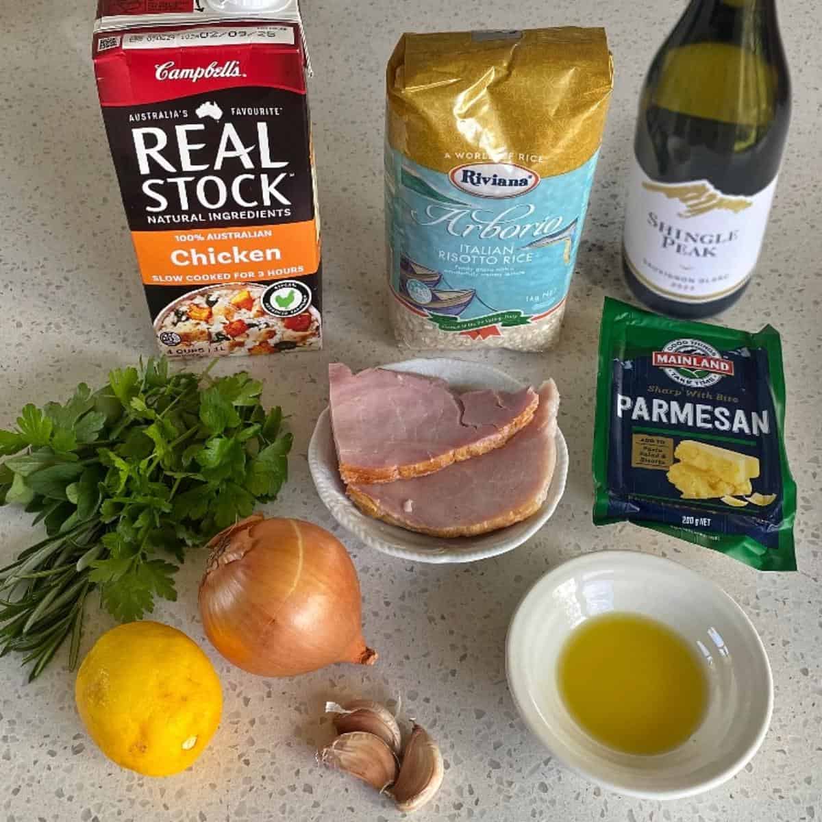 The ingredients to make Ham and Parmesan Risotto on a marble bench top