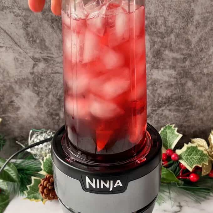 Cranberry Margarita mixture being blended in a Ninja