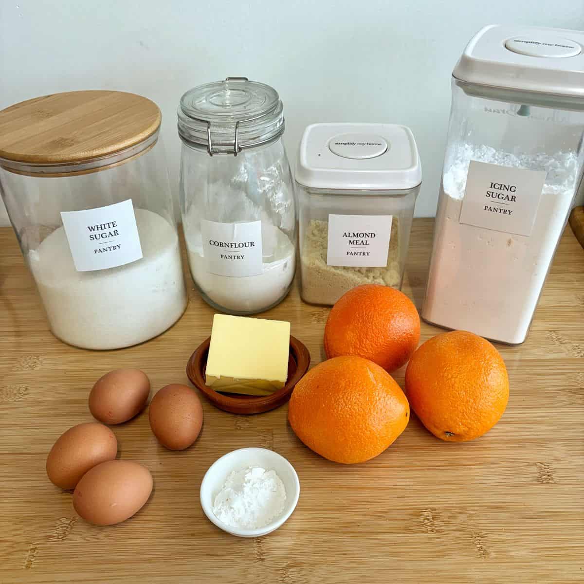 The ingredients to make mini jaffa cakes on a wooden bench.