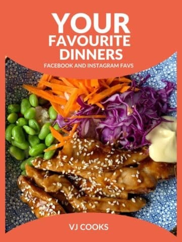 A bowl with sliced sesame-coated chicken, edamame beans, shredded purple cabbage, grated carrot, rice, and a dollop of mayonnaise, featured in the Your Favourite Dinners collection.