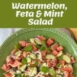Chopped watermelon, cucumber, red onion, feta, and mint are mixed in a bowl and served on a green plate as a fresh salad.