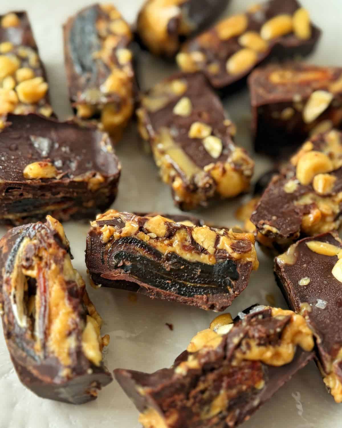 Snickers Peanut Butter Bites Pieces of chocolate-covered date and peanut candy topped with sea salt.