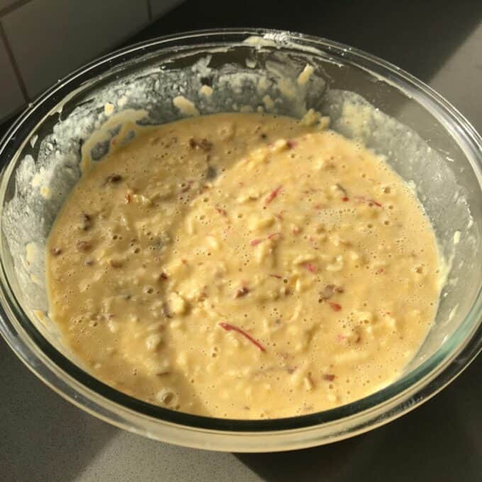 Lumberjack Cake Batter with shredded fruit or vegetables in a glass mixing bowl.